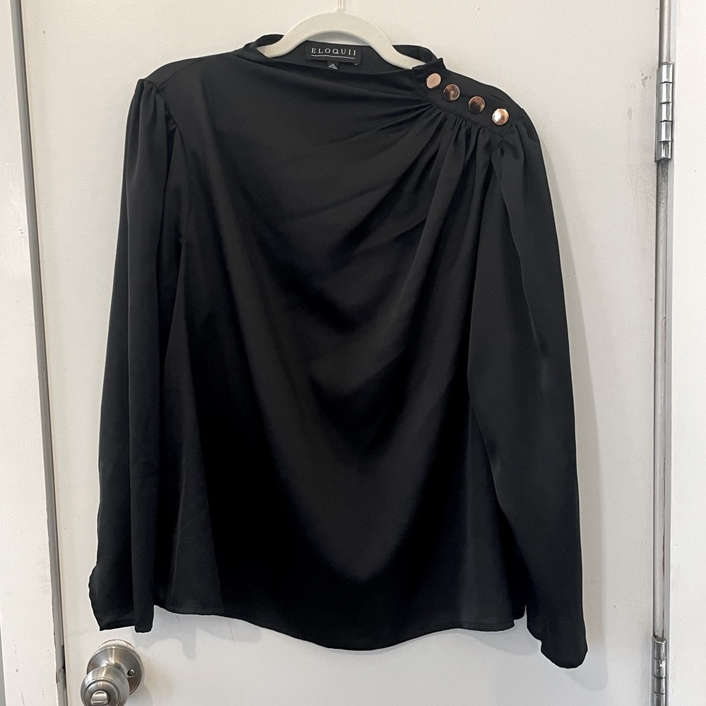 Black satin shirt with gold button detail.